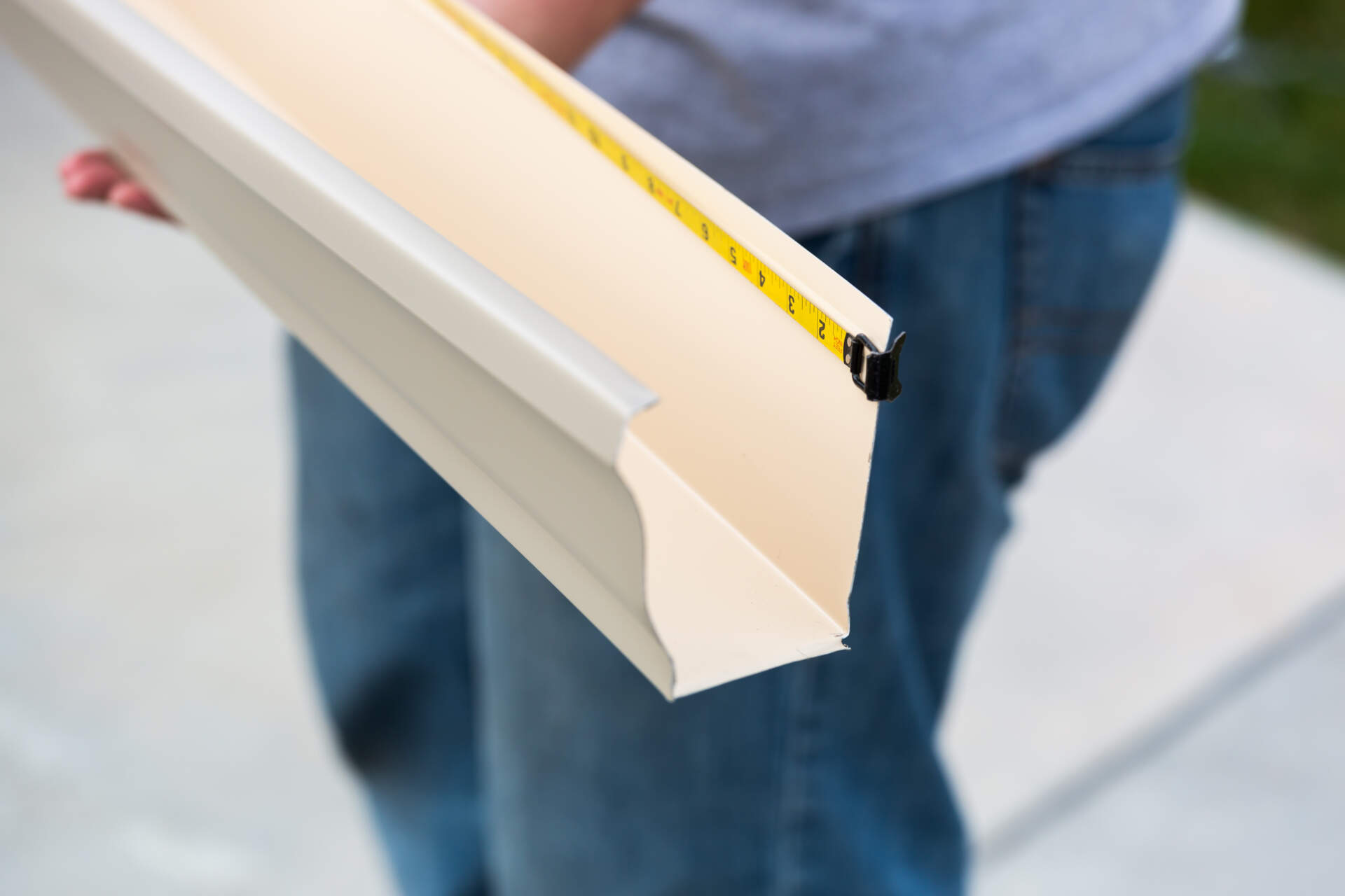 Charleston gutter company sizing gutters for residential customer.